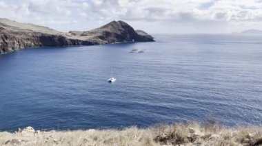 Panorama view from the seafront on Madeira, sea, blue sky, boat, sunny day
