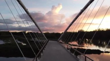 A drone footage of the Peter Courtney Minto Island Bridge at sunset in Salem, Oregon, the USA