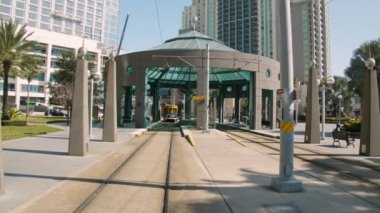 The tram shelter in Dick Greco Plaza on background of high-rise buildings in downtown Tampa FL, USA