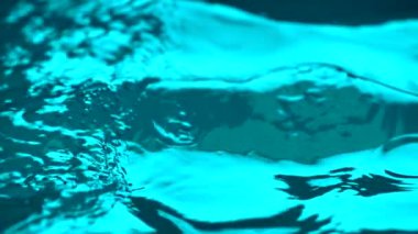 A closeup footage of a crystal clear water and many small drops