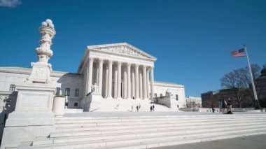 A 4k time lapse of people at the Supreme Court in Washington DC on a clear day.