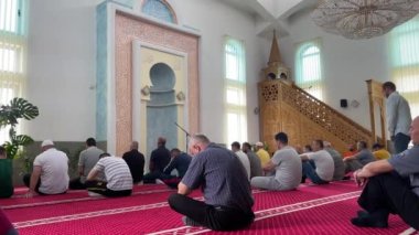 A group of people in mosque during the Friday midday prayer in Bosnia and Herzegovina