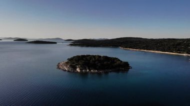The aerial drone footage of the archipelago against the blue sky.