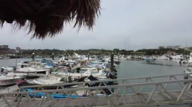 An HD footage of fishing boats at the port at Tamsui fisherman's wharf