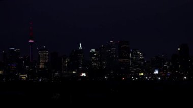 The time-lapse of the Toronto, Ontario, Canada skyline at night while the sun begins to rise