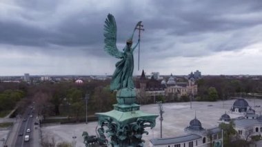 A scenic view of Heroes' Square with the statue of archangel Gabriel in Budapest