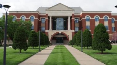 A static frame footage of a walkway leading to the Johnson County Kansas (KS) Administration Building
