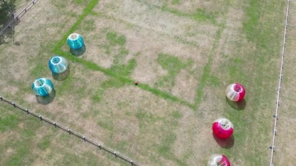 Aerial View Bumper Balls Two Teams Bubble Football Grass Field — Wideo stockowe