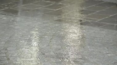 Lady running and jumping over puddle