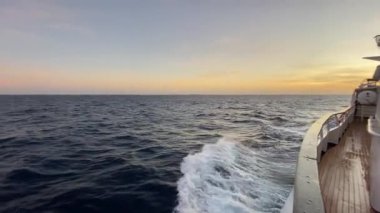 A beautiful seascape seen from a tourist yacht in motion during the sunset