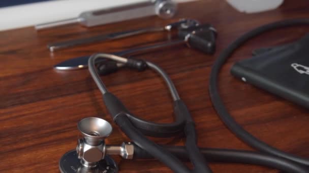 Closeup Medical Stethoscope Wooden Table — Vídeos de Stock