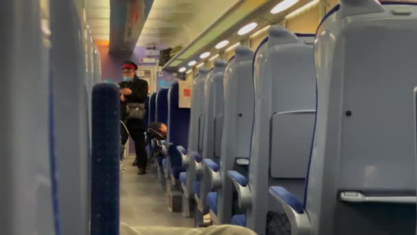 Ticket Officer Passes Train Hallway Checking Tickets — Stockvideo