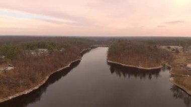 This was a beautiful sunset flight over a calm river toward a dam with a beautiful purple cloud backdrop.