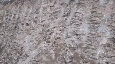 TheDigger's bucket marks on the rock while digging basement at the construction site - digger bucket