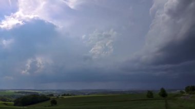 A time lapse of cloudscape over greenery fields