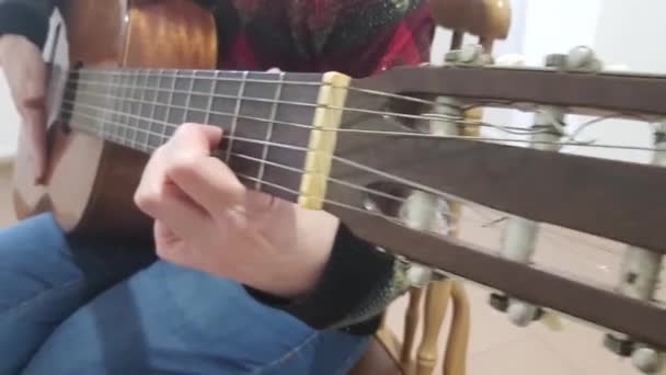 Person Sitting Playing Wooden Guitar — Stok video