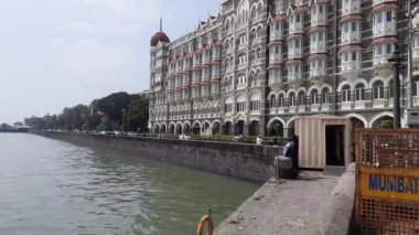 Early morning low angle view of the Taj Mahal Palace Hotel in Mumbai. Barriers block certain parts of the building to increase security