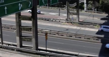 An aerial view of cars driving over the bridge in Sydney, Australia