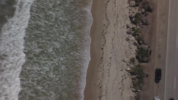 Aerial Drone View Foamy Waves Crashing Sandy Beach Malibu Sunny — Stockvideo