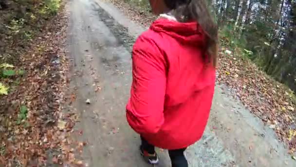 Young Female Red Sportive Outfit Running Narrow Road Trees — Stock Video