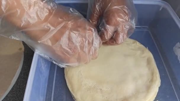 Person Taking Crepes Pile Plastic Container — Vídeo de Stock
