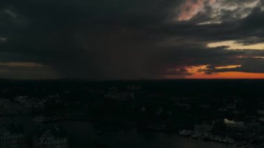 Distant isolated rain storm passing after sunset