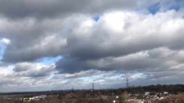 Rainy clouds run over the park winter time