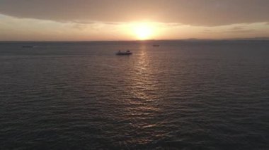 A high angle view of a white boat sailing on Madeira Island, Portugal