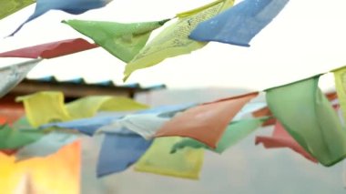 A closeup footage of the Tibetan prayer flags waving in the wind