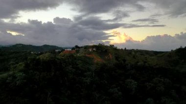 An aerial view of vast mountain landscape and houses in the center island of Puerto Rico