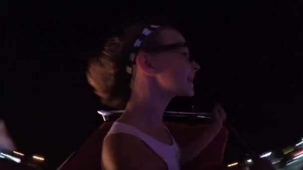 Happy Girl Glasses Rides Amusement Park Ride Colorful Evening Lighting — Video Stock