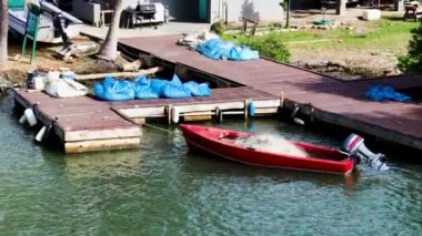 A moored fishing boat at the dock on a sunny day