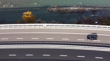 A drone view of a bridge and river near the city of Bolzano in the  South Tyrol, Italy