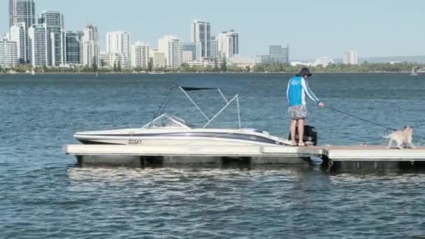 View Man His Dog Dock Next Boat — Video Stock