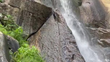 A closeup shot of a beautiful waterfall flowing in the forest in Richmond Virginia, USA