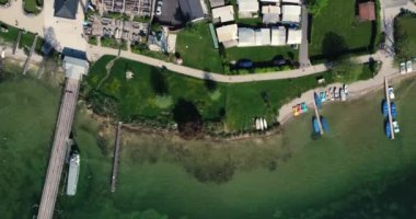 A drone shot over the small touristic town Gstadt am Chiemsee in Bavaria by the sea