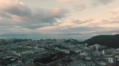 An aerial view of Quito city in Ecuador under a cloudy sky