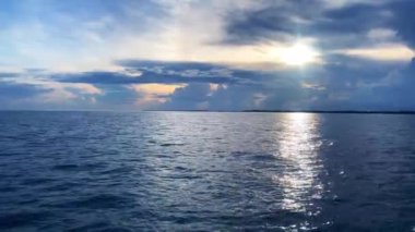 A scenic shot of the peaceful sea waves hitting the shore