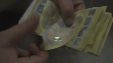 A closeup footage of a person counting his cash money