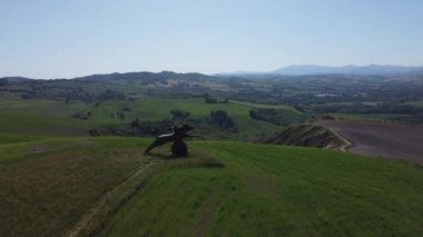 The drone footage of the horse sculpture in Urbino. Statua-pensiero-cavallo-urbino. Montefabbri, Italy.