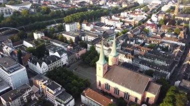 A drone flight over a church and city in Wuppertal, Germany