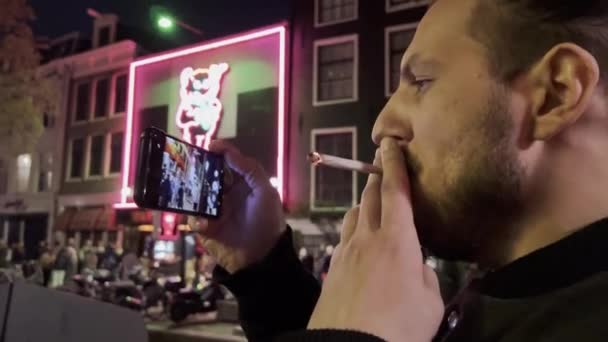 Hispanic Young Man Smoking Filming Phone Amsterdam Red Light District — Stockvideo