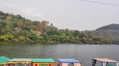 A high angle view of colorful houses near the sea in Bhimtal, India