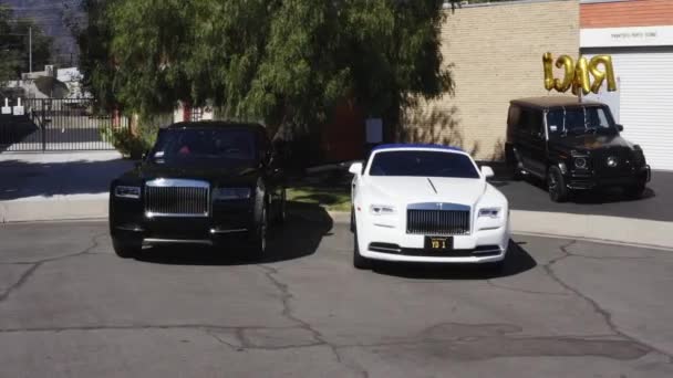 Black White Pair Rolls Royce Cars Parked Street — Video