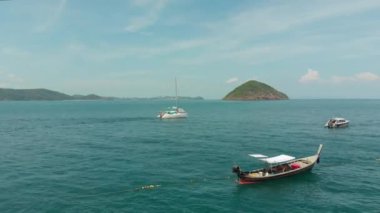 An aerial view of the sea with yachts and speed boats in Thailand Phuket Pang, Nga Bay