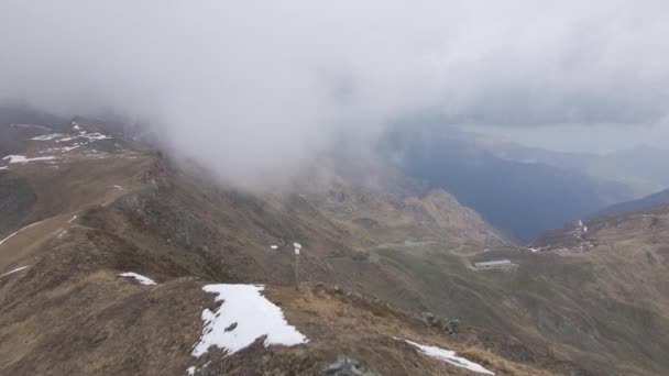 Hiker Walking Top Mountain While Snowing — Vídeos de Stock