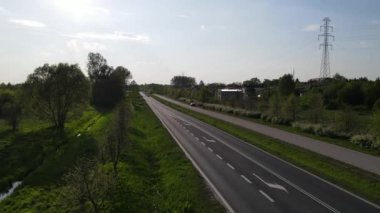 An aerial shot of the traffic on an asphalt highway in the suburbs of Radom, Poland