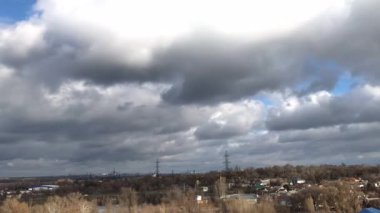 Rainy clouds run over the park winter time