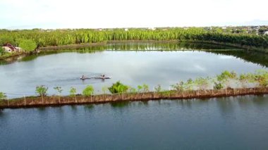 A scenic shot of a lake surrounded by a forest