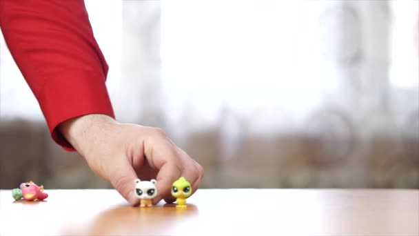 Close Person Small Toys Arranging Them Table — Video